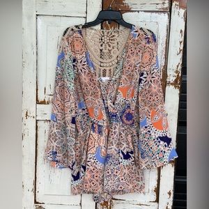 Colorful low cut romper with a lace back